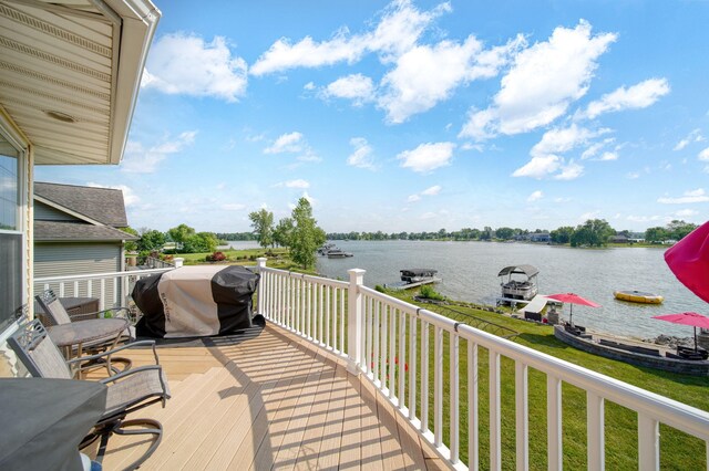 8321 Odowling Dr, Onsted, MI 49265 - wooden deck with grilling area, a water view, and a lawn