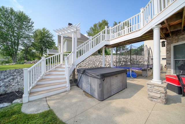 8321 Odowling Dr, Onsted, MI 49265 - view of patio / terrace with a trampoline, a hot tub, stairs, and a wooden deck