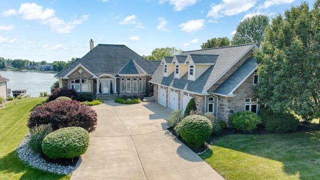8321 Odowling Dr, Onsted, MI 49265 - view of front of property with stone siding, driveway, and a front yard