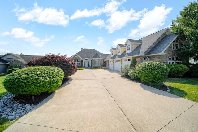 8321 Odowling Dr, Onsted, MI 49265 - view of front of property featuring concrete driveway and stone siding