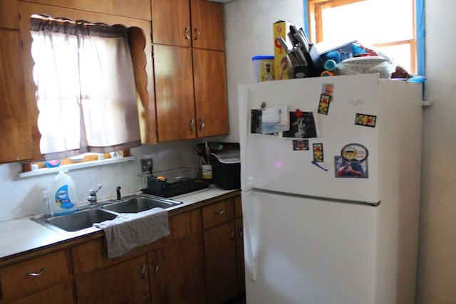 43 N Lincoln Ave, Niles, MI 49120 - kitchen featuring freestanding refrigerator, plenty of natural light, and brown cabinets