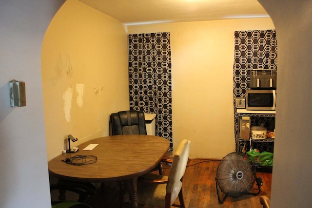43 N Lincoln Ave, Niles, MI 49120 - dining space with wood finished floors and arched walkways