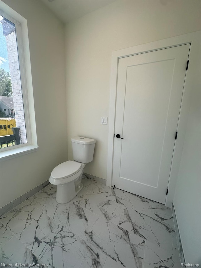 1666 Albany St, Ferndale, MI 48220 - bathroom with toilet and marble look tiles