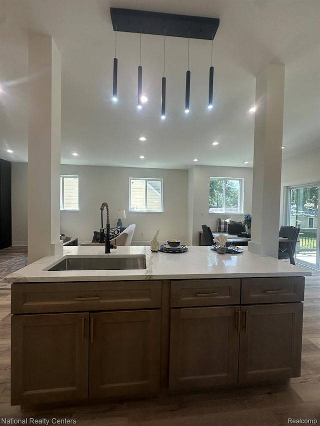 1666 Albany St, Ferndale, MI 48220 - kitchen featuring open floor plan, dark wood-style floors, recessed lighting, and hanging light fixtures