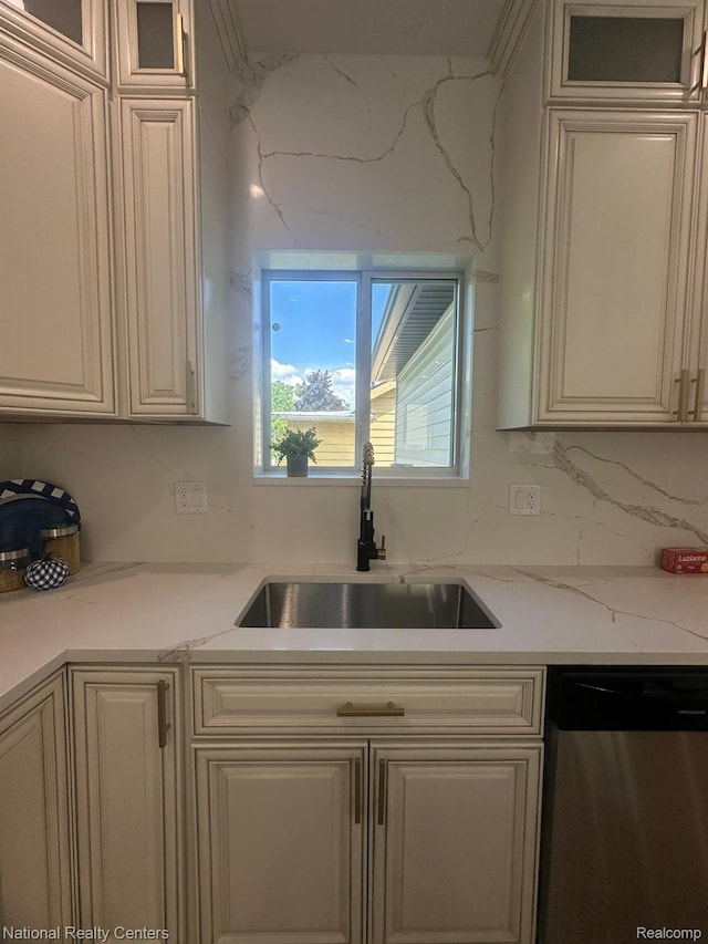 1666 Albany St, Ferndale, MI 48220 - kitchen with dishwasher, glass insert cabinets, decorative backsplash, and light stone counters