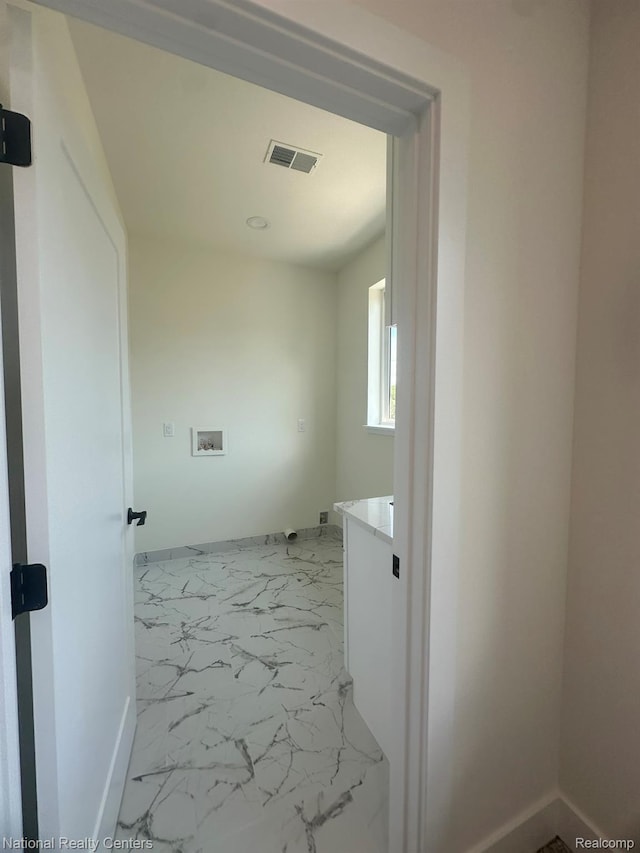 1666 Albany St, Ferndale, MI 48220 - washroom with marble look tile flooring and washer hookup