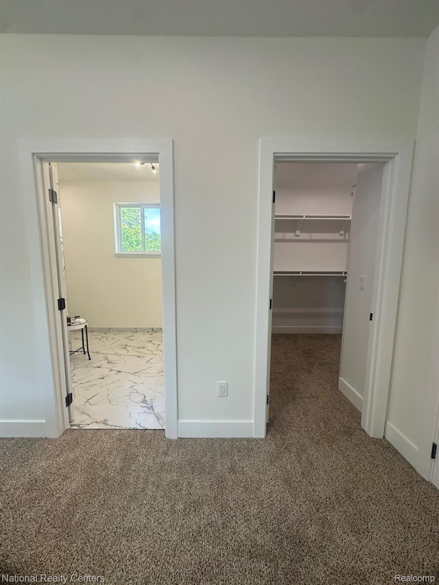 1666 Albany St, Ferndale, MI 48220 - unfurnished bedroom with a spacious closet, carpet flooring, and marble look tiles