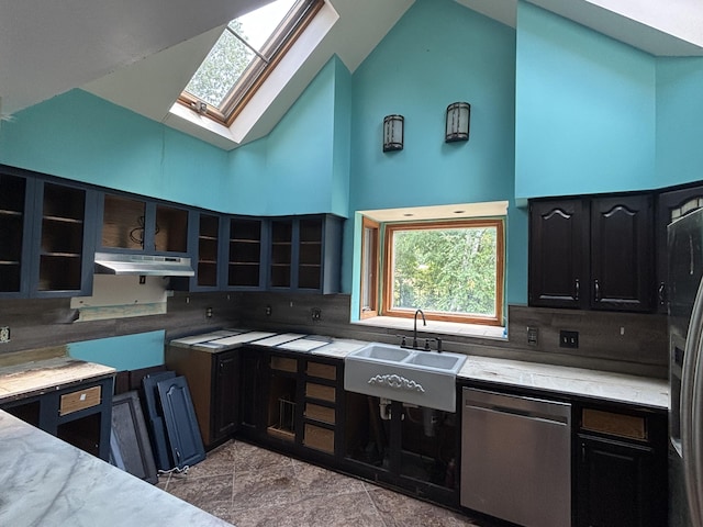 135 S Steer St, Addison, MI 49220 - kitchen featuring stainless steel appliances, a skylight, under cabinet range hood, tasteful backsplash, and high vaulted ceiling