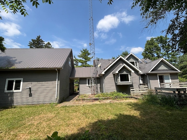 135 S Steer St, Addison, MI 49220 - view of front of house with a front yard and a metal roof