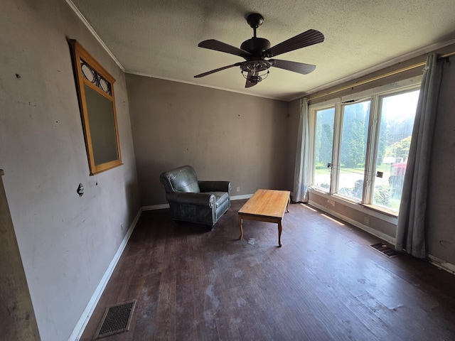 106 Orourke Ct, Brooklyn, MI 49230 - sitting room with wood finished floors, a textured ceiling, a ceiling fan, and ornamental molding
