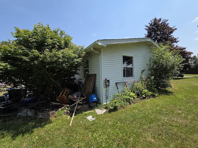 106 Orourke Ct, Brooklyn, MI 49230 - view of property exterior featuring a lawn