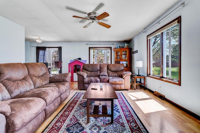 287-289 S Waverly Rd, Holland, MI 49423 - living room featuring light wood finished floors and a ceiling fan