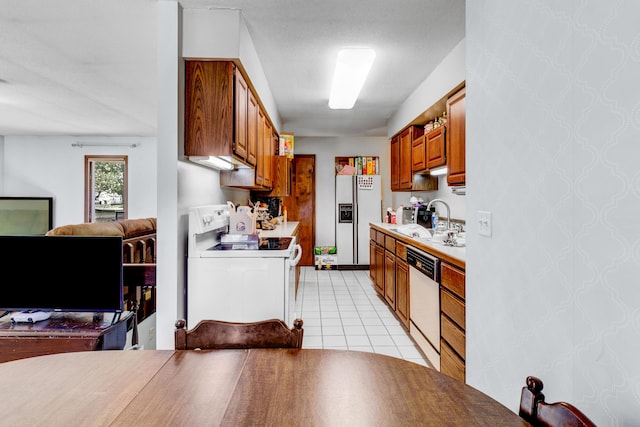 287-289 S Waverly Rd, Holland, MI 49423 - kitchen featuring white appliances, brown cabinetry, light countertops, light tile patterned flooring, and open floor plan