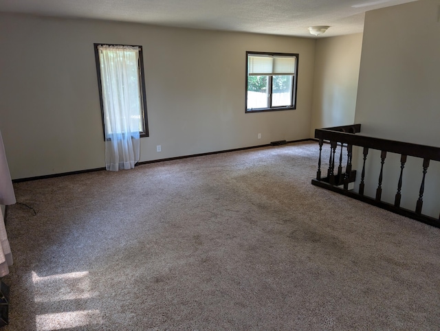 287-289 S Waverly Rd, Holland, MI 49423 - spare room featuring carpet flooring and baseboards