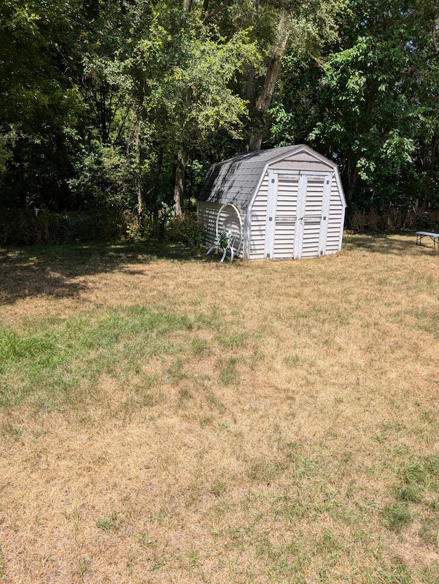 287-289 S Waverly Rd, Holland, MI 49423 - view of green lawn featuring a shed