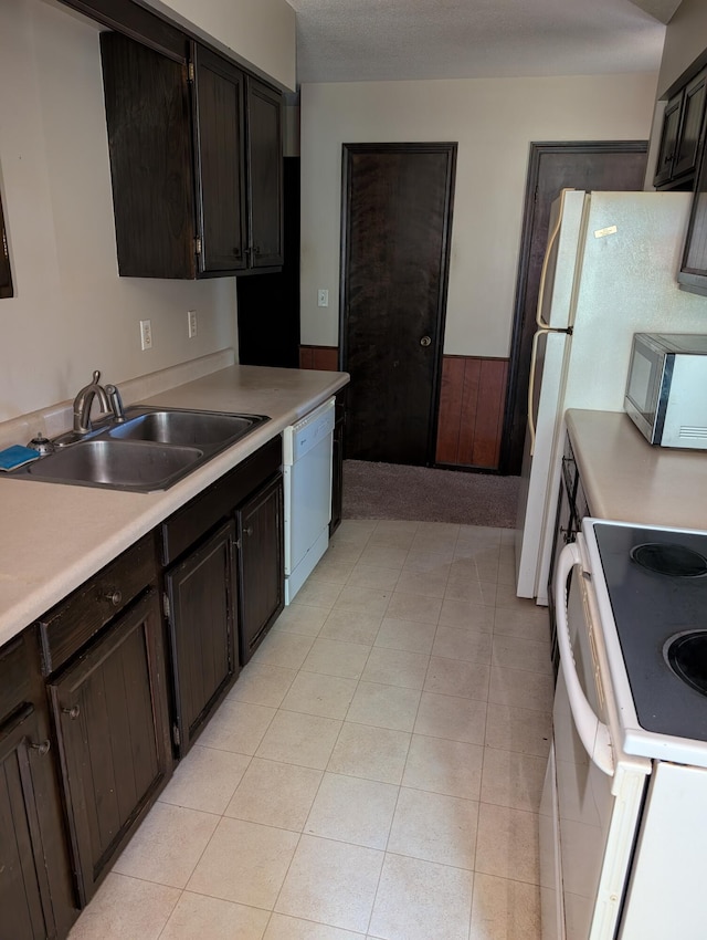 287-289 S Waverly Rd, Holland, MI 49423 - kitchen with white appliances, light countertops, and light tile patterned flooring