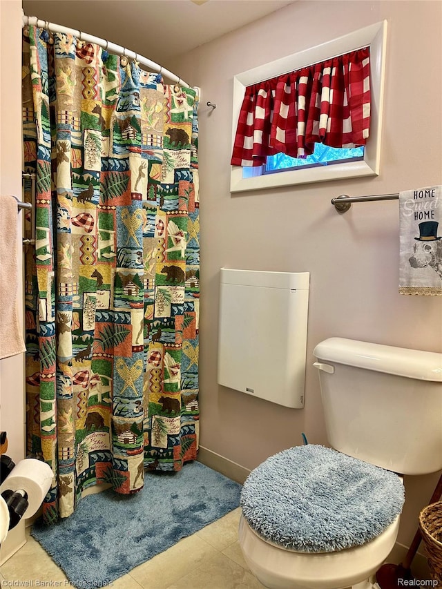 7351 Chain Lake Dr, South Branch, MI 48761 - bathroom with tile patterned floors and a shower with shower curtain