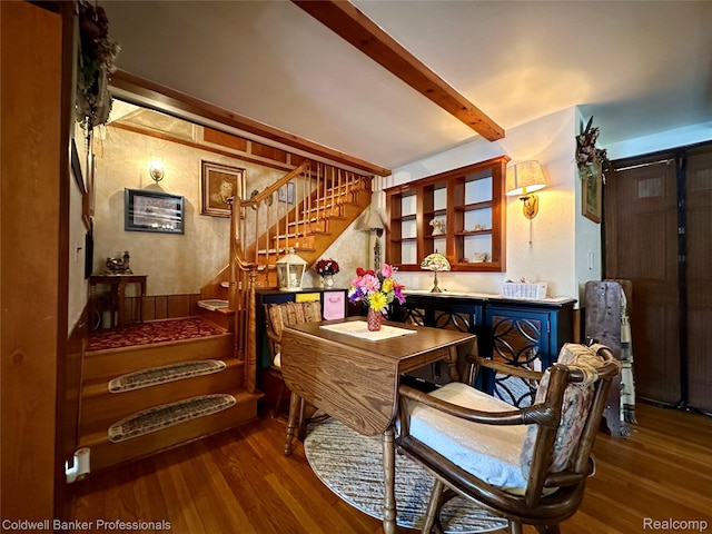 7351 Chain Lake Dr, South Branch, MI 48761 - dining room featuring wood finished floors, stairway, beam ceiling, and a bar