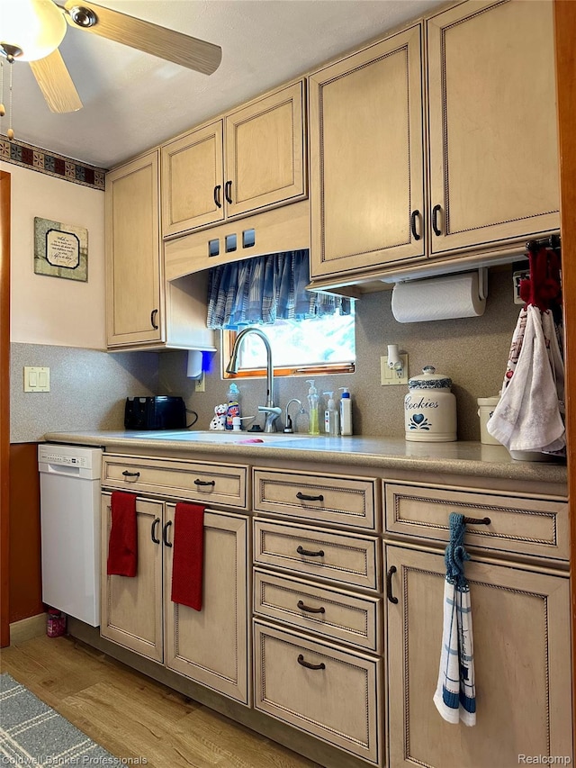 7351 Chain Lake Dr, South Branch, MI 48761 - kitchen featuring white dishwasher, light wood-style floors, light countertops, ceiling fan, and decorative backsplash