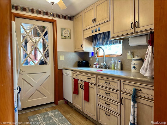 7351 Chain Lake Dr, South Branch, MI 48761 - kitchen featuring dishwasher, decorative backsplash, light wood-type flooring, light countertops, and a ceiling fan
