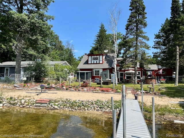 7351 Chain Lake Dr, South Branch, MI 48761 - rear view of house with a water view