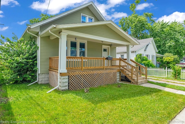 509 13th St, Port Huron, MI 48060 - bungalow-style home with covered porch and stairs