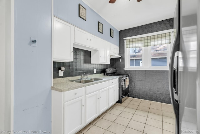 509 13th St, Port Huron, MI 48060 - kitchen with appliances with stainless steel finishes, light tile patterned floors, light countertops, white cabinets, and custom exhaust hood