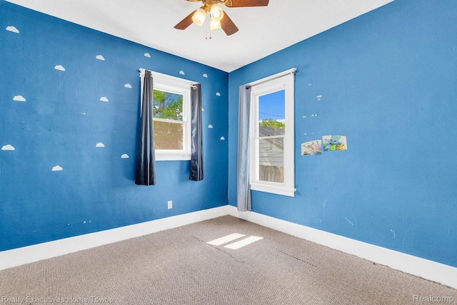 509 13th St, Port Huron, MI 48060 - carpeted empty room with a ceiling fan and baseboards