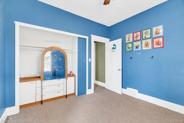 509 13th St, Port Huron, MI 48060 - unfurnished bedroom with carpet, a closet, and ceiling fan