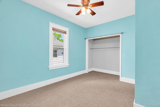 509 13th St, Port Huron, MI 48060 - unfurnished bedroom featuring carpet floors, a closet, and a ceiling fan