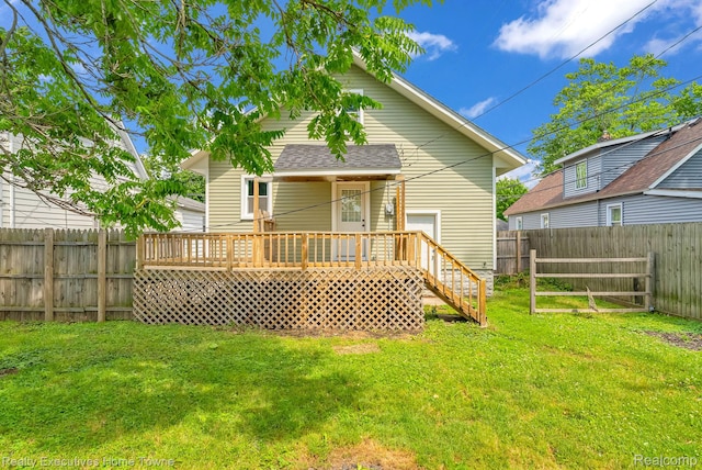 509 13th St, Port Huron, MI 48060 - rear view of house featuring a fenced backyard and a deck