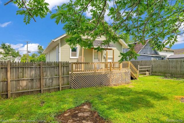 509 13th St, Port Huron, MI 48060 - rear view of property with a fenced backyard and a deck