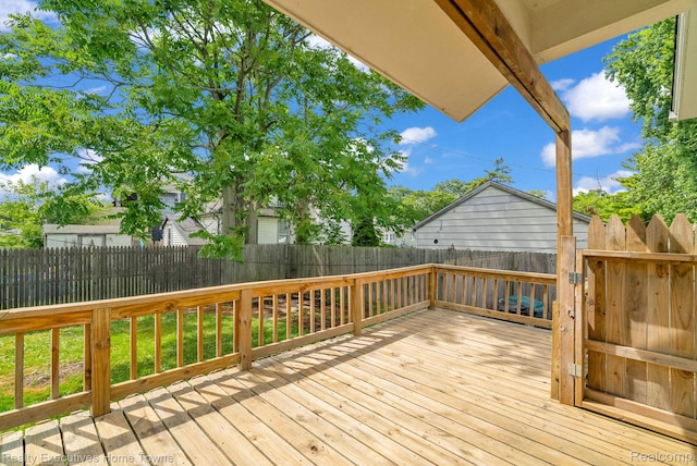 509 13th St, Port Huron, MI 48060 - wooden terrace featuring a fenced backyard