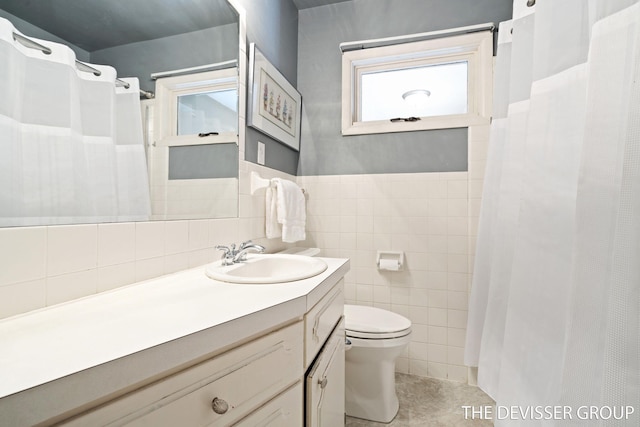 817 Central Ave, Holland, MI 49423 - bathroom featuring tile walls, vanity, and a shower with curtain
