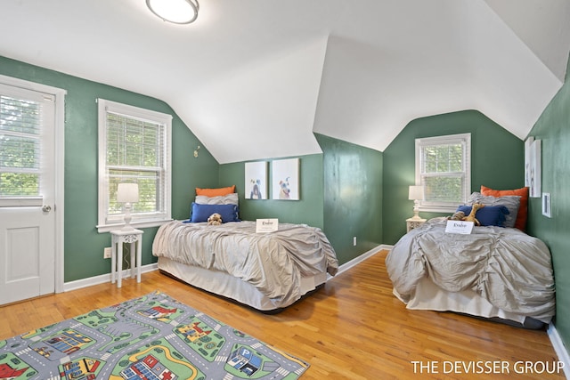 817 Central Ave, Holland, MI 49423 - bedroom featuring wood finished floors and lofted ceiling