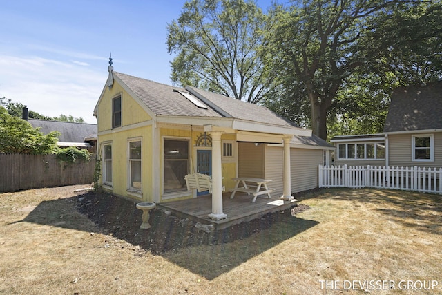817 Central Ave, Holland, MI 49423 - rear view of property with a shingled roof and a fenced backyard