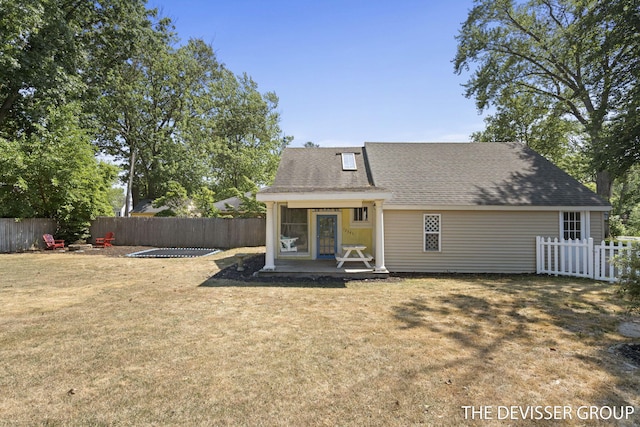 817 Central Ave, Holland, MI 49423 - rear view of house with a fenced backyard and a shingled roof