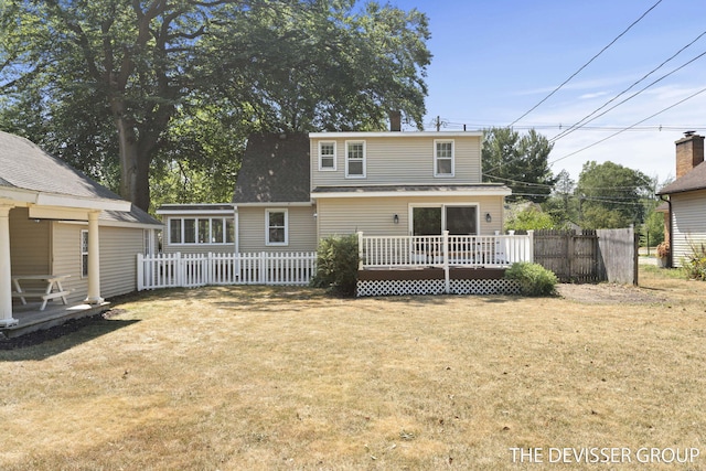 817 Central Ave, Holland, MI 49423 - back of property with a wooden deck and roof with shingles