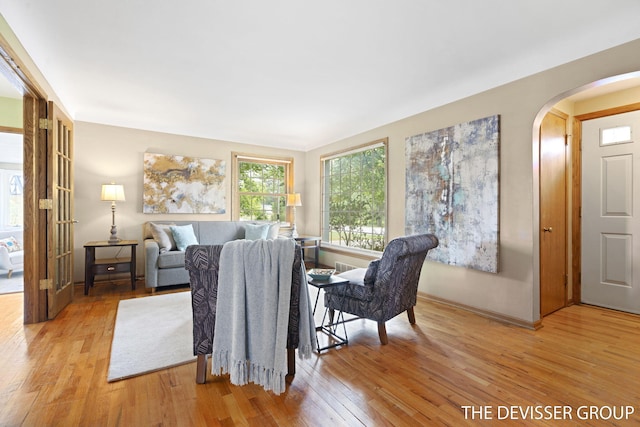 817 Central Ave, Holland, MI 49423 - living area featuring arched walkways and light wood-type flooring