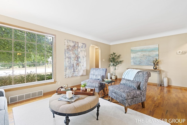 817 Central Ave, Holland, MI 49423 - sitting room with arched walkways and wood finished floors