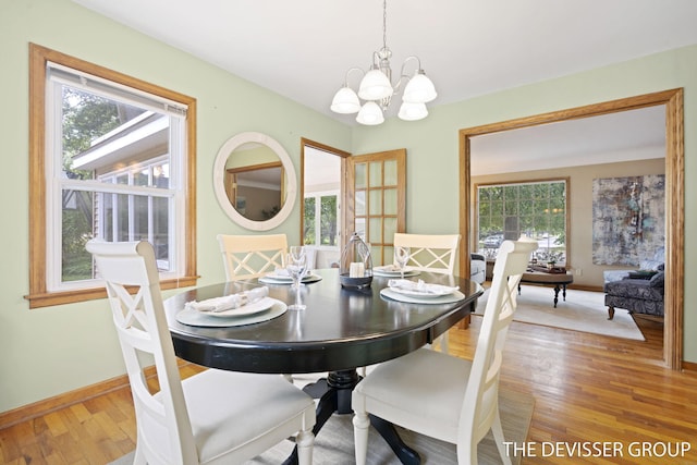 817 Central Ave, Holland, MI 49423 - dining area with a chandelier and light wood finished floors