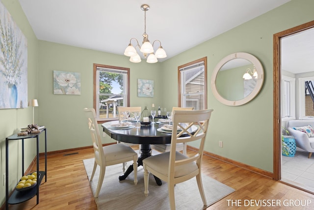 817 Central Ave, Holland, MI 49423 - dining space featuring a chandelier and light wood-style flooring