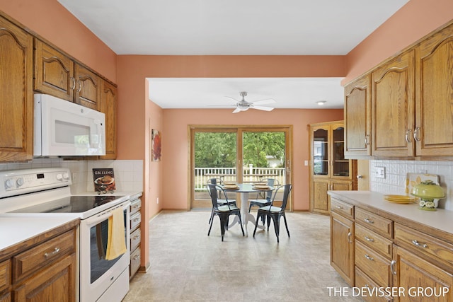 817 Central Ave, Holland, MI 49423 - kitchen with white appliances, brown cabinetry, and light countertops