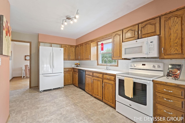 817 Central Ave, Holland, MI 49423 - kitchen with white appliances, brown cabinets, light countertops, and decorative backsplash
