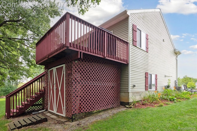 9481 Common Trl, Pinckney, MI 48169 - view of home's exterior with stairs, a deck, and a lawn
