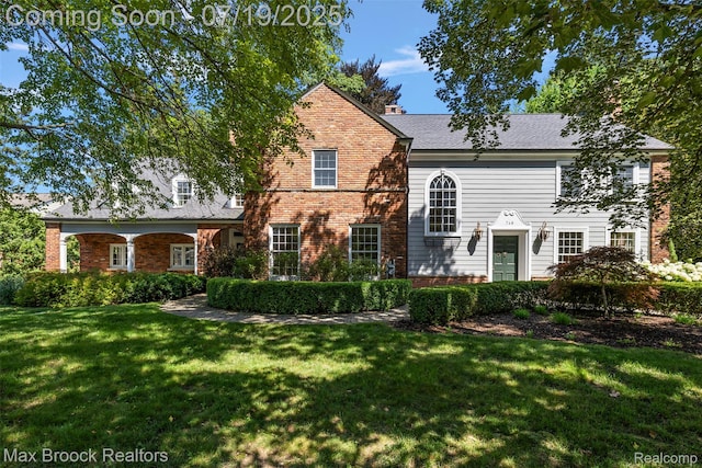 748 Waddington St, Bloomfield Hills, MI 48301 - view of front of house featuring a front lawn and brick siding