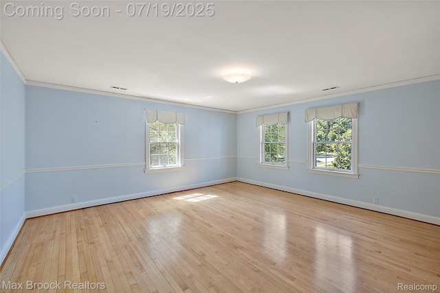 748 Waddington St, Bloomfield Hills, MI 48301 - spare room featuring ornamental molding, plenty of natural light, and hardwood / wood-style floors