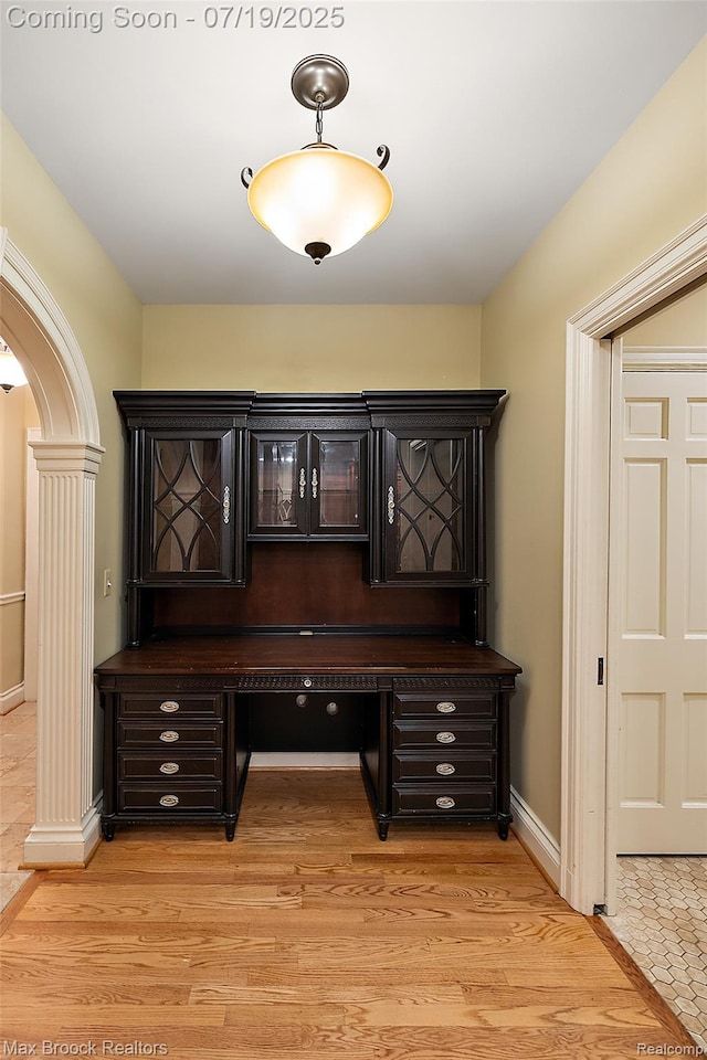 748 Waddington St, Bloomfield Hills, MI 48301 - unfurnished office with arched walkways and light wood-style floors