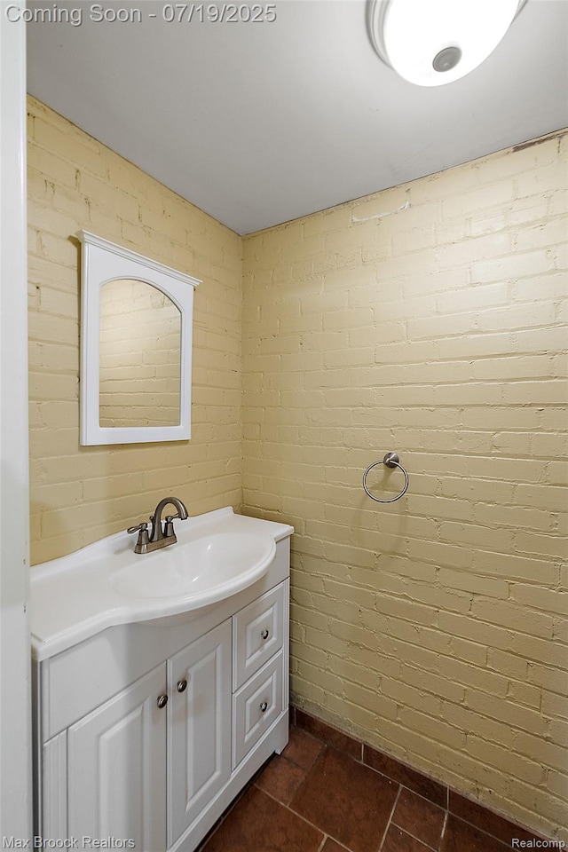 748 Waddington St, Bloomfield Hills, MI 48301 - bathroom with brick wall and vanity