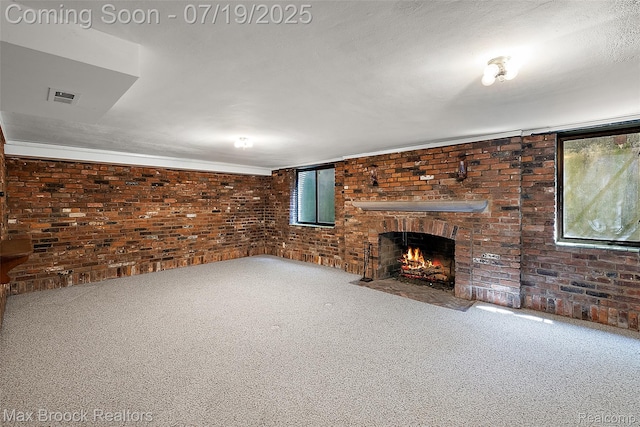 748 Waddington St, Bloomfield Hills, MI 48301 - unfurnished living room featuring brick wall, carpet, a brick fireplace, and crown molding
